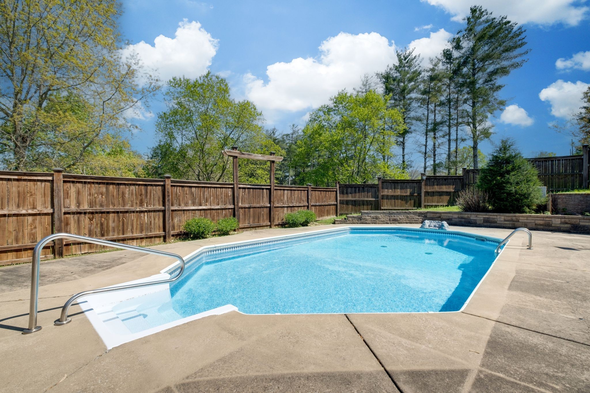 1249 White Road Bon Aqua, TN 37025 - Photo 2 of 60 a view of a backyard with a swimming pool and sitting area