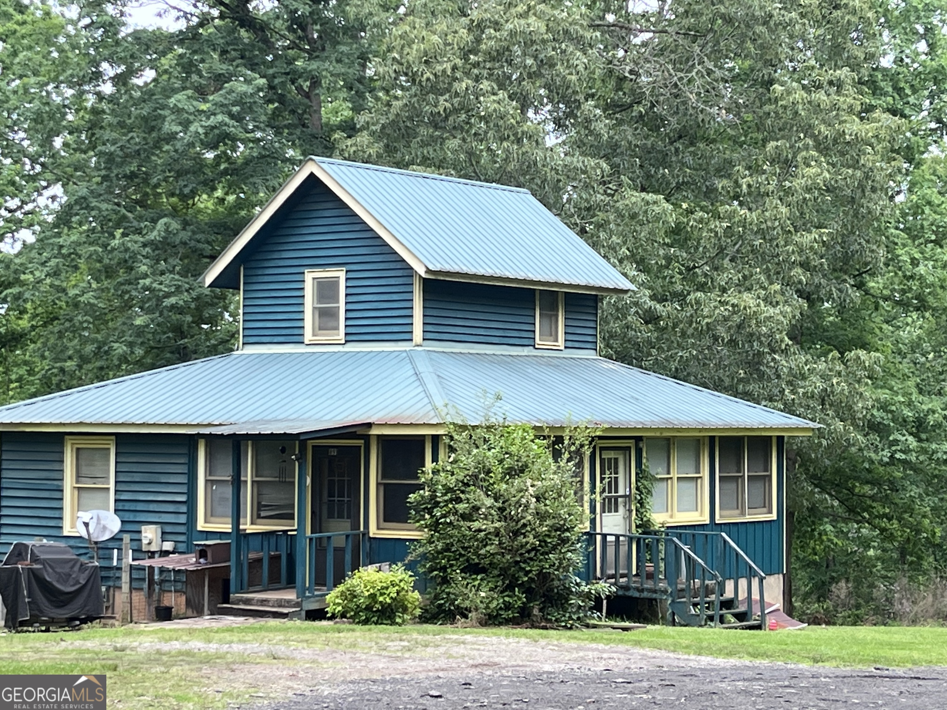 891 Hooper Road Cleveland, GA 30528 - Photo 1 of 1 a front view of a house with garden