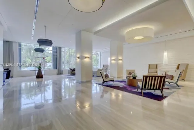a bathroom with a double vanity sink mirror and shower