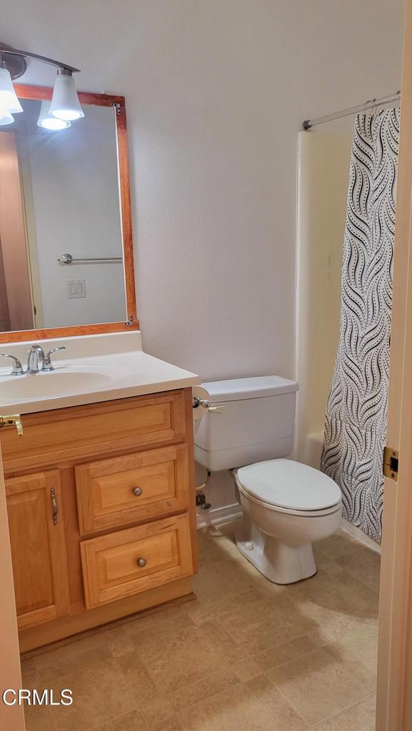 2065 East Bard Road Oxnard, CA 93033 - Photo 15 of 18 a bathroom with a sink a toilet and mirror