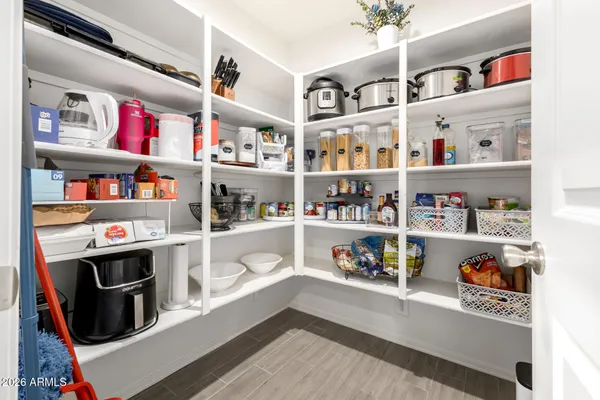 a cabinet with a book shelf and a shelf