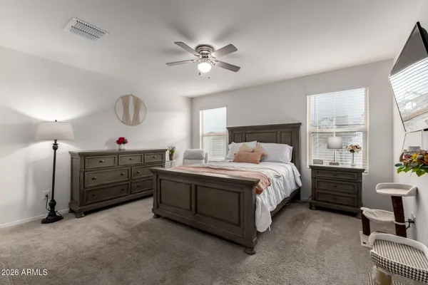a bed room with a bed and a chandelier