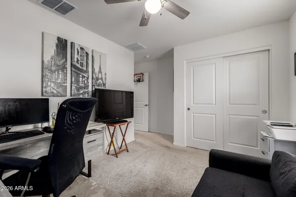 a view of a livingroom with workspace and a couch