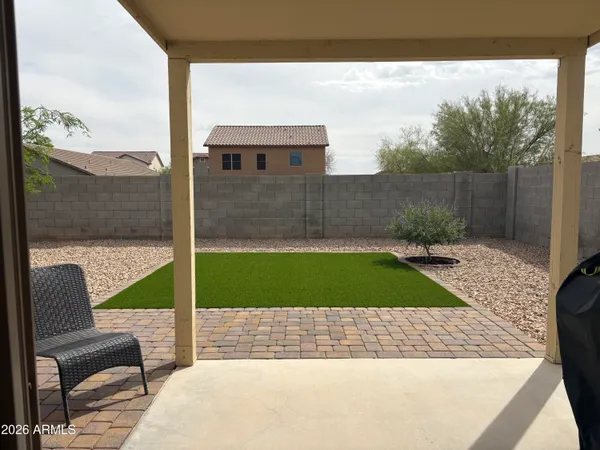 a view of a chair and table in the patio