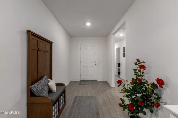 a living room with furniture and flowers