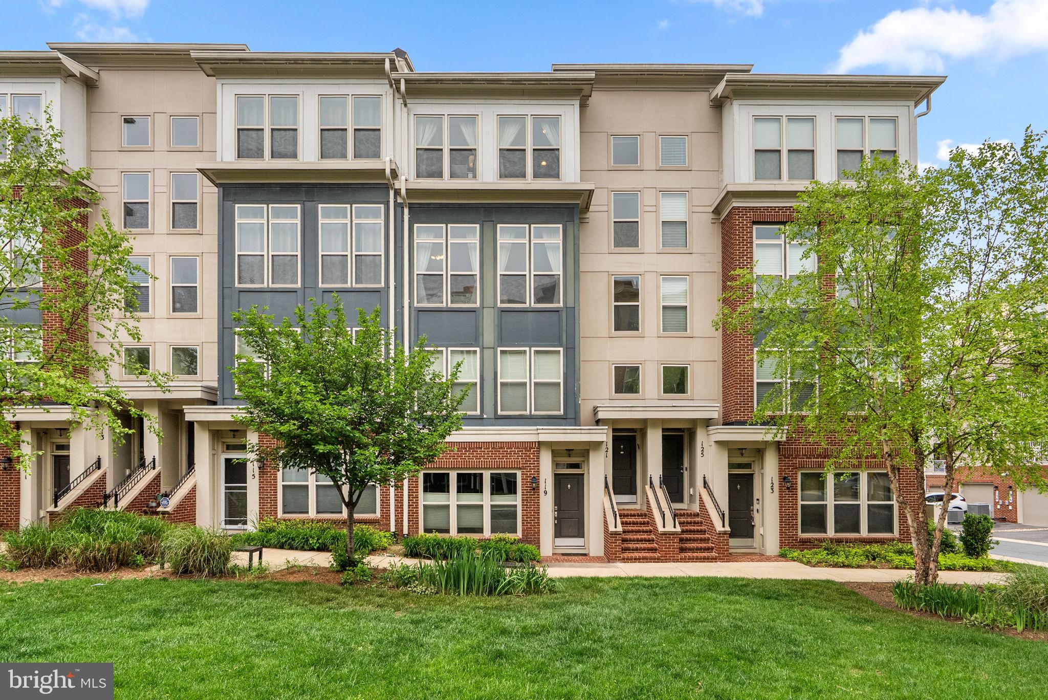 121 Copley Circle, Unit 34B Gaithersburg, MD 20878 - Photo 1 of 43 front view of a building with a yard