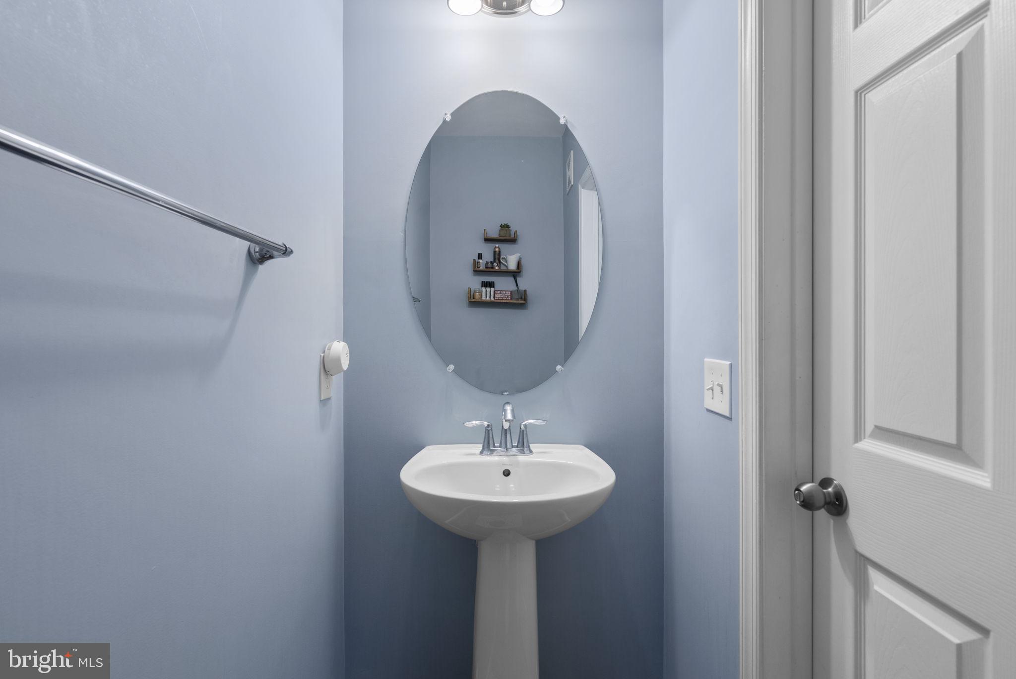 121 Copley Circle, Unit 34B Gaithersburg, MD 20878 - Photo 23 of 43 a bathroom with a sink and a mirror