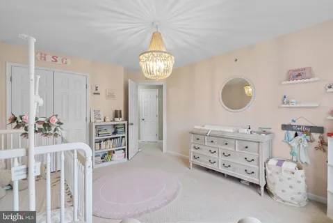 a view of a bedroom with furniture