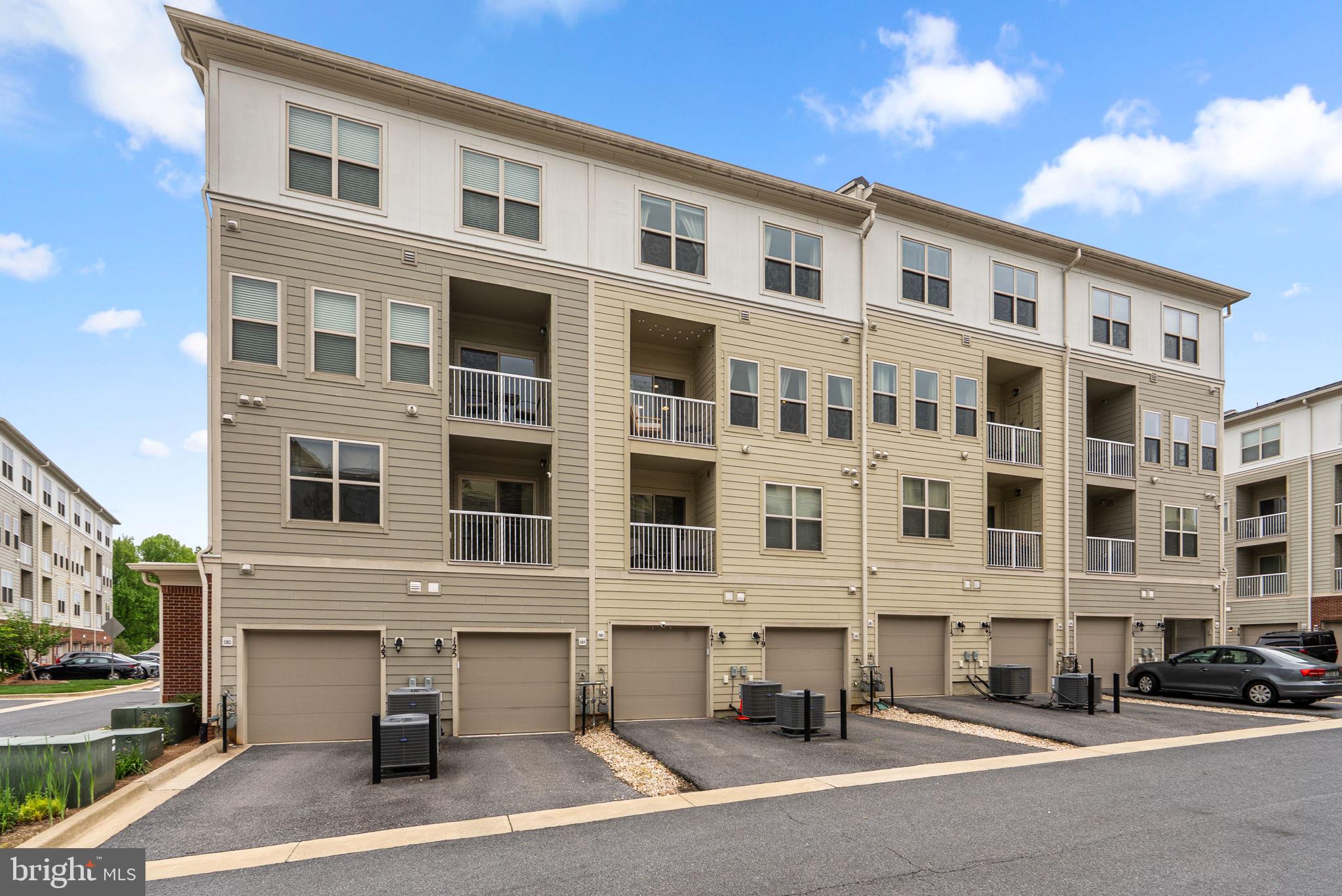 121 Copley Circle, Unit 34B Gaithersburg, MD 20878 - Photo 42 of 43 a front view of a building with street view