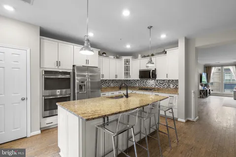 a kitchen with a table and chairs in it