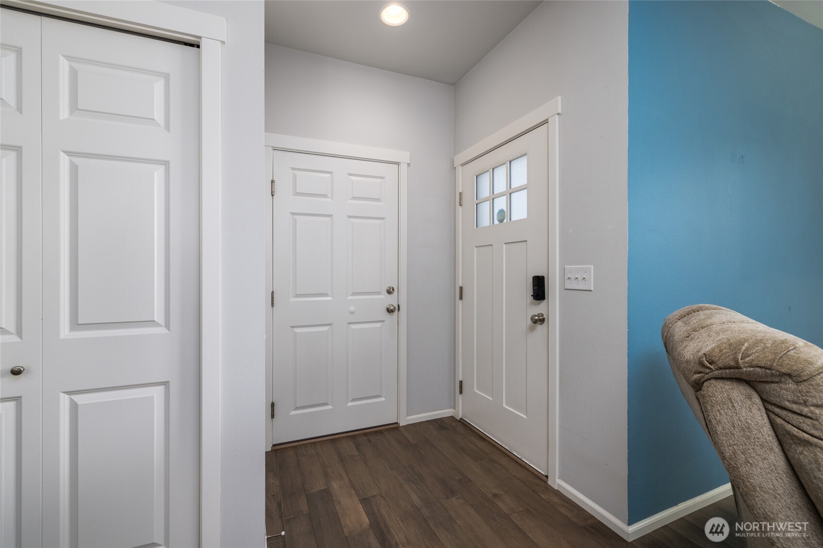 232 Sinclair Alley Mount Vernon, WA 98274 - Photo 4 of 33 a view of a hallway with wooden floor and closet