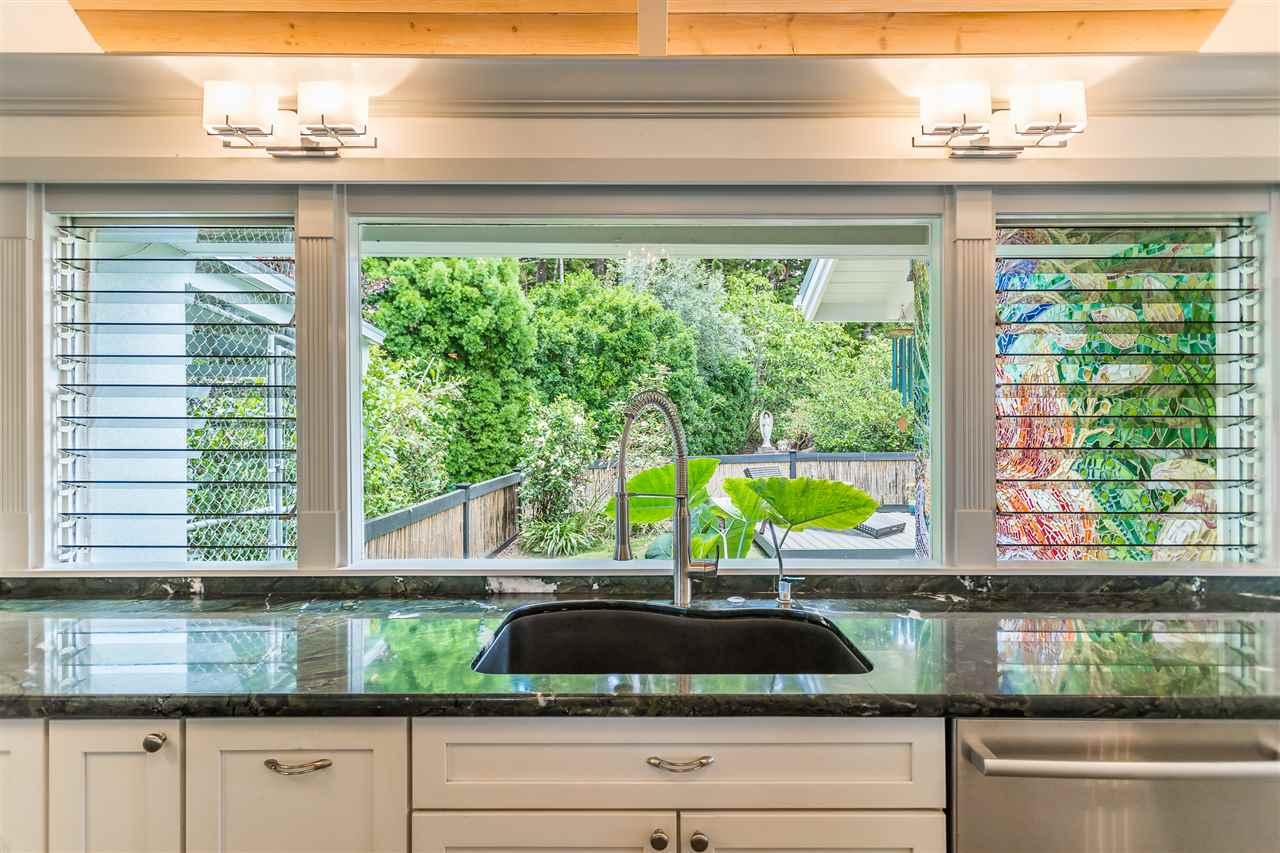 2425 Lilikoi Road Haiku, HI 96708 - Photo 11 of 30 a kitchen with a window sink and cabinets