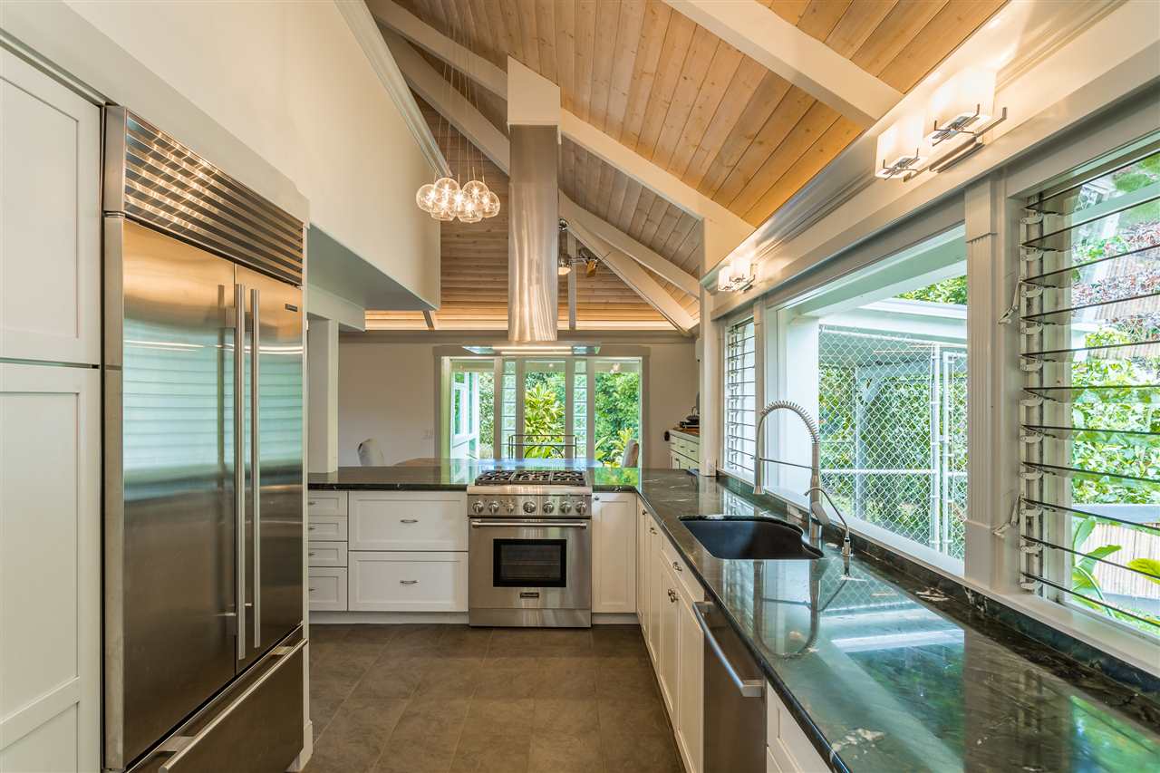2425 Lilikoi Road Haiku, HI 96708 - Photo 12 of 30 a kitchen with stainless steel appliances granite countertop a sink and a large window