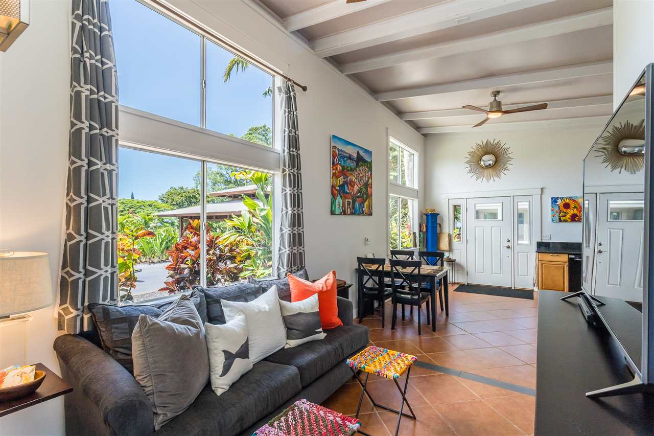 2425 Lilikoi Road Haiku, HI 96708 - Photo 21 of 30 a living room with fireplace furniture and a flat screen tv
