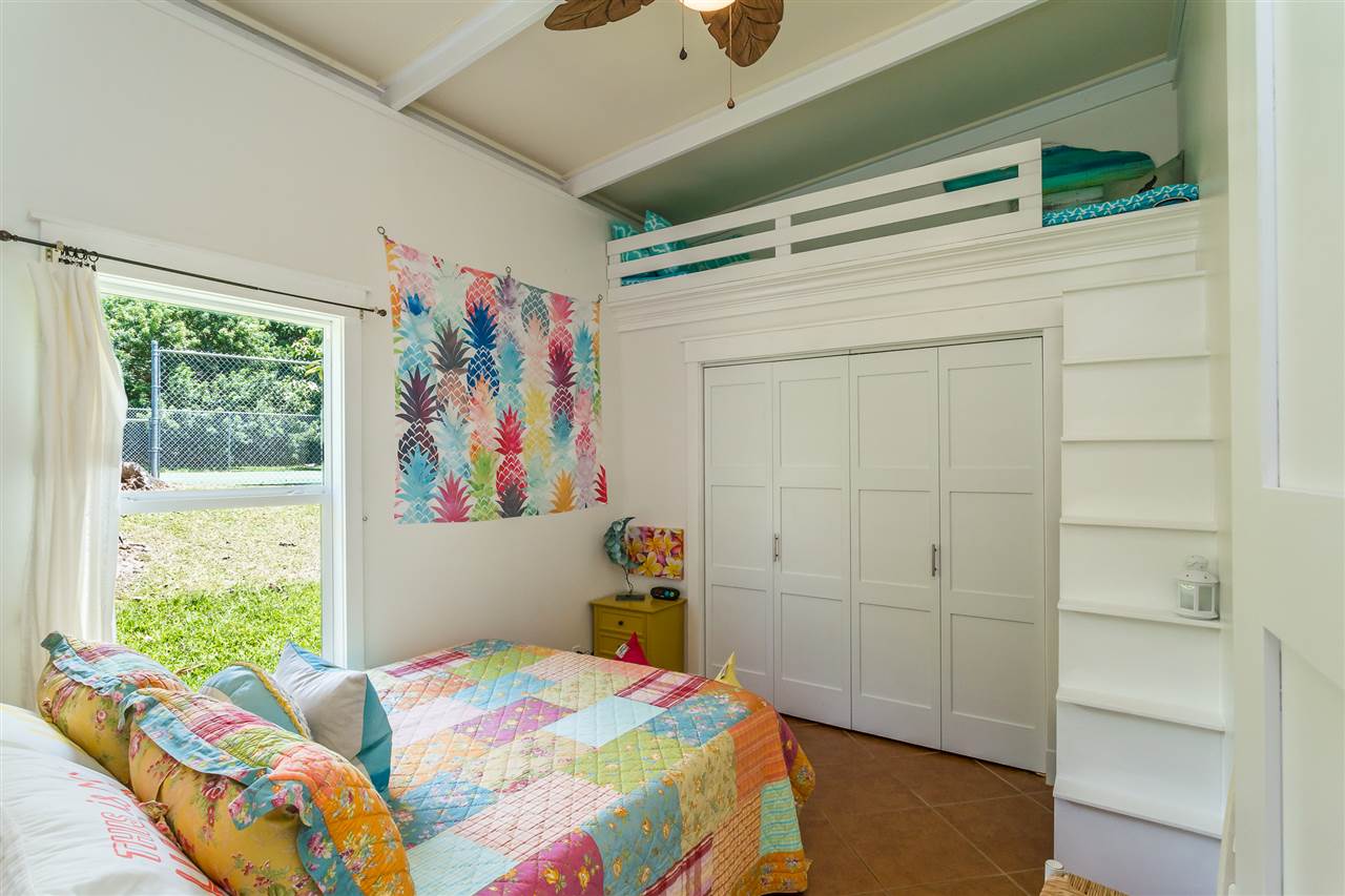 2425 Lilikoi Road Haiku, HI 96708 - Photo 23 of 30 a bedroom with a bed and a window