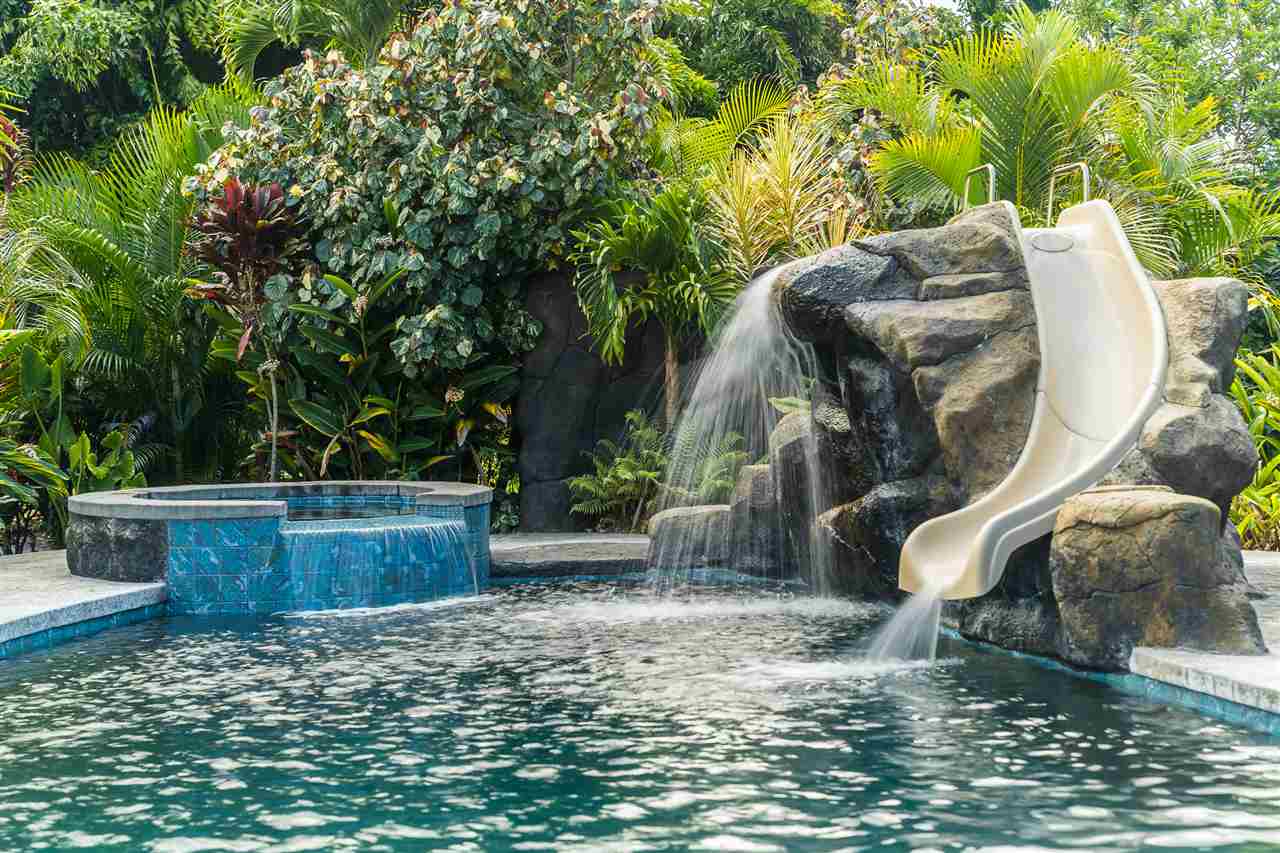 2425 Lilikoi Road Haiku, HI 96708 - Photo 26 of 30 a backyard of a house with table and chairs