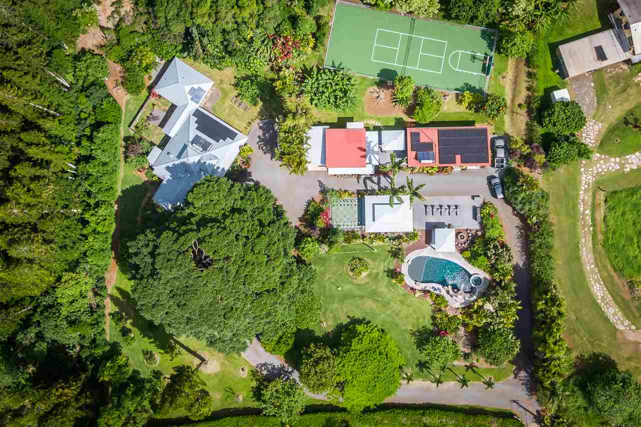2425 Lilikoi Road Haiku, HI 96708 - Photo 29 of 30 an aerial view of a house with a yard and tennis court