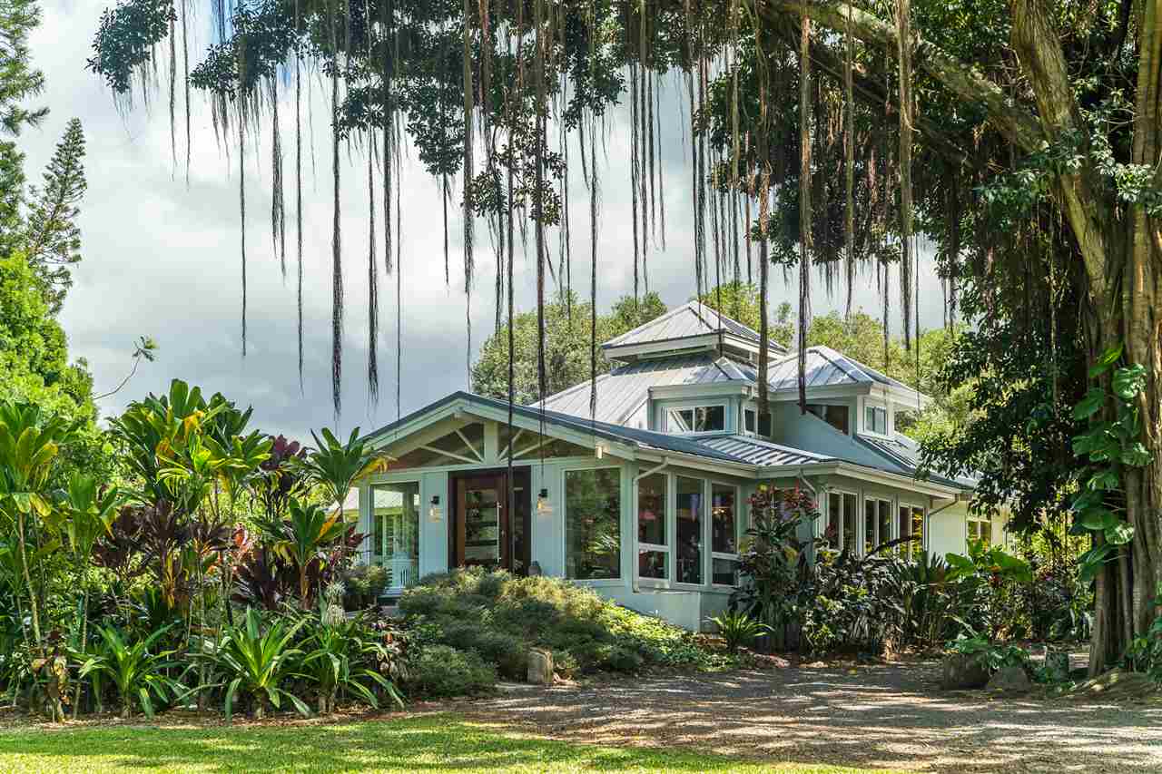 2425 Lilikoi Road Haiku, HI 96708 - Photo 3 of 30 a view of a house with a yard and potted plants
