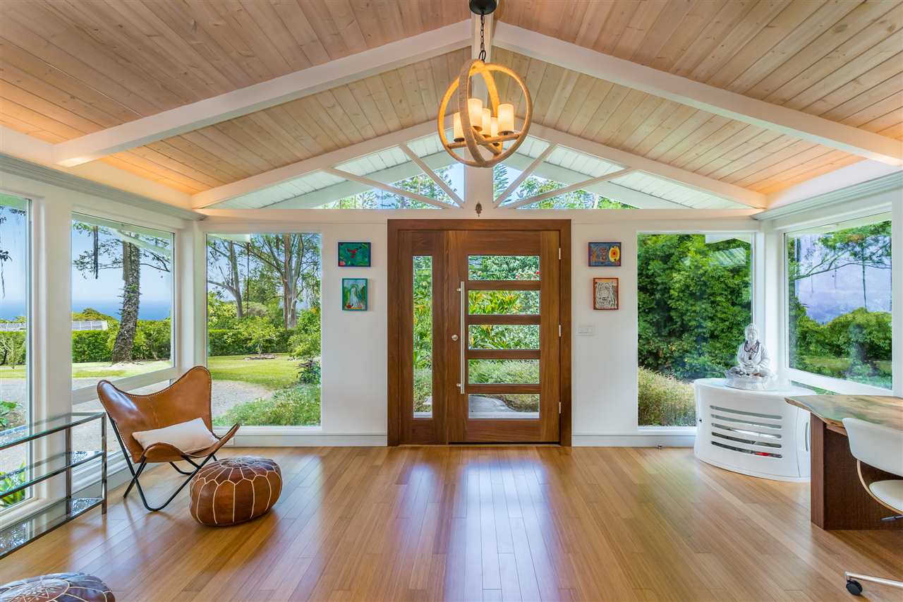 2425 Lilikoi Road Haiku, HI 96708 - Photo 4 of 30 a view of a dining room with furniture a chandelier and wooden floor