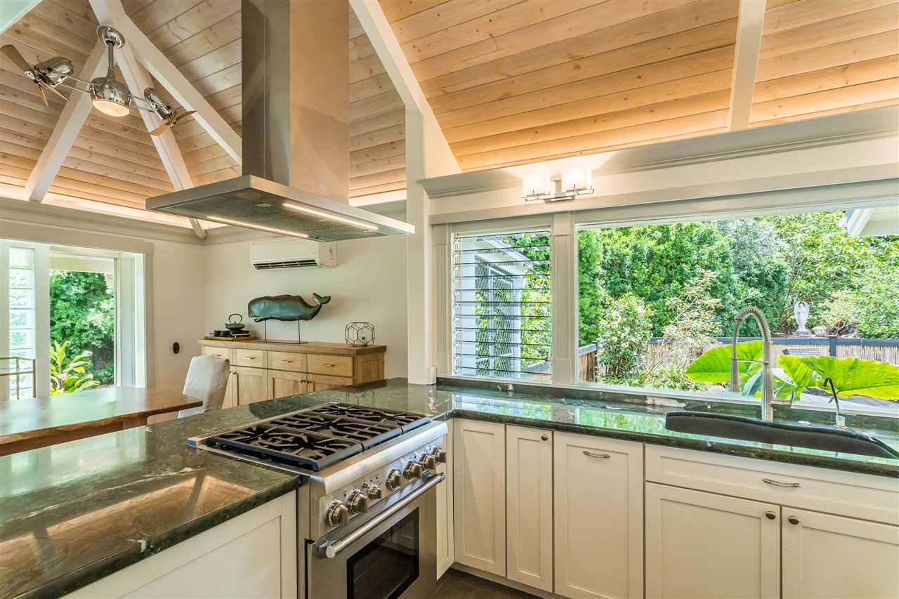 2425 Lilikoi Road Haiku, HI 96708 - Photo 10 of 30 a kitchen with a stove a sink and a large window