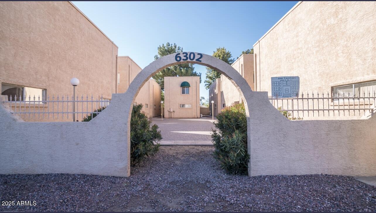 a view of a big building with large windows and a yard