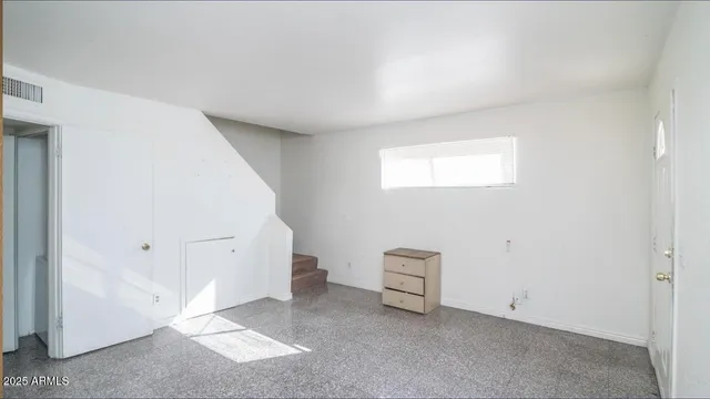 an empty room with windows