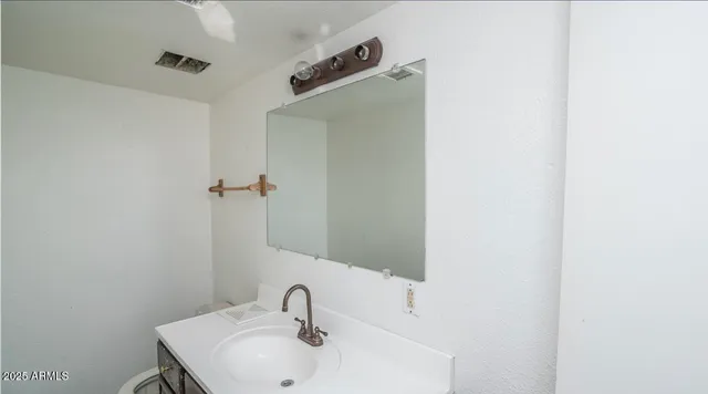 a bathroom with a sink and mirror