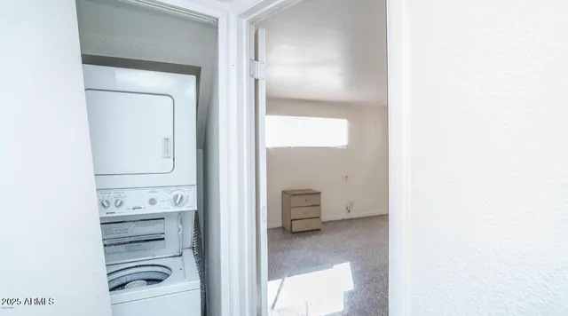 a view of walk in closet with cabinet