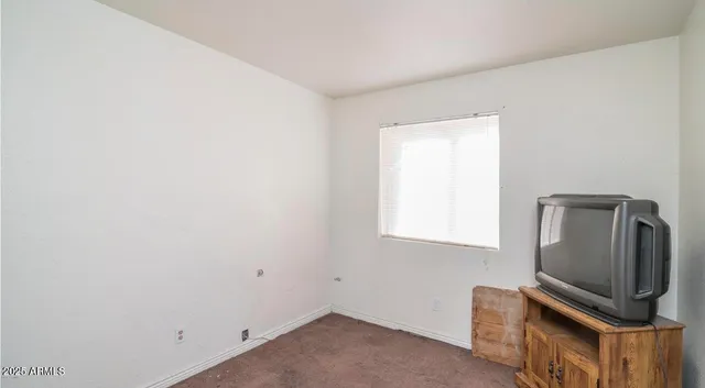 a room with window and wooden floor