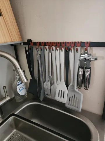 a view of walk in closet with clothes