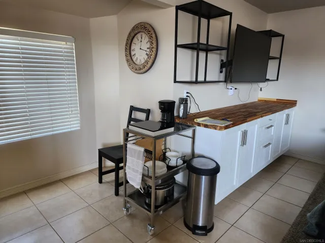 a kitchen with a cabinets a stove and a table