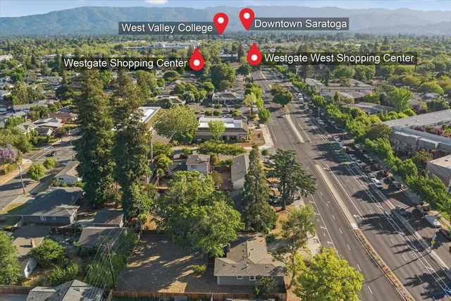 an aerial view of a houses with yard