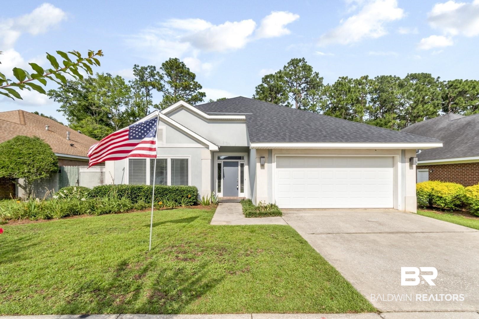 1205 Hillcrest Crossing East Mobile, AL 36695 - Photo 5 of 40 View of front of property with a garage and a front lawn