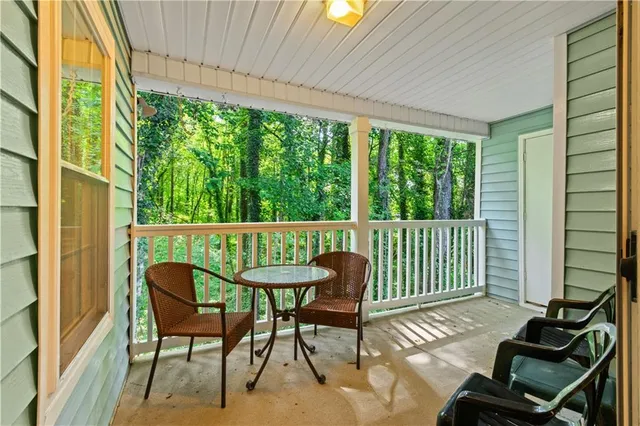 a view of a balcony with furniture