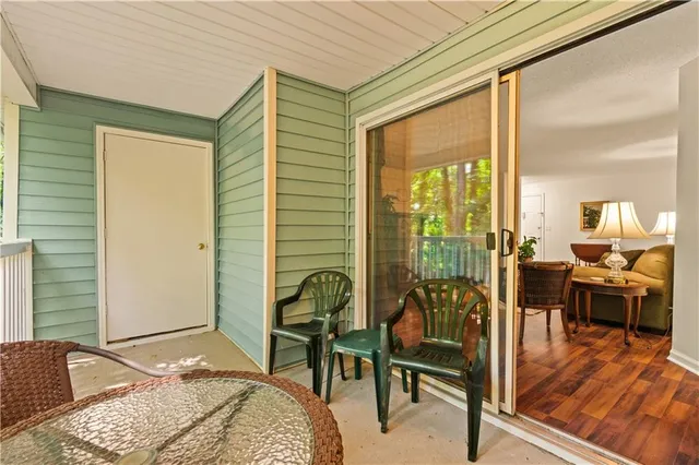 a bedroom with furniture and a large window