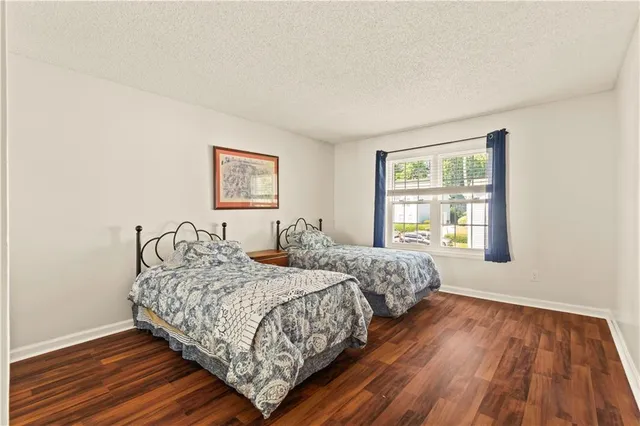 a bedroom with two beds and a window