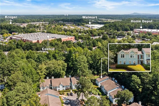 an aerial view of a house with a swimming pool yard and outdoor seating