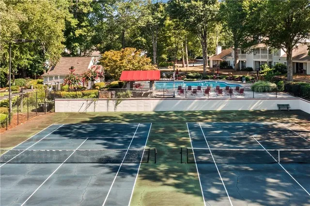 a view of a swimming pool with sitting area