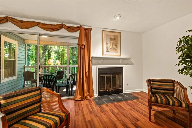 a bedroom with furniture and a fireplace