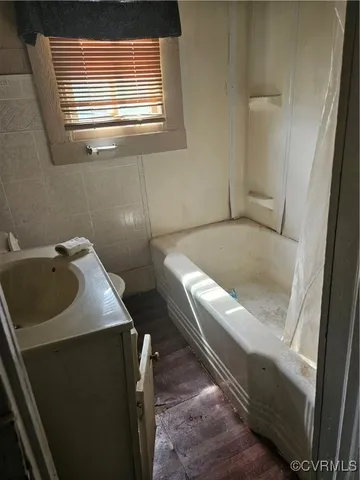 a bathroom with a sink and bathtub
