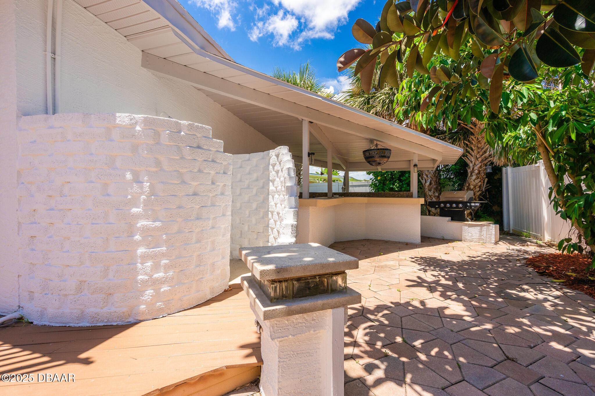 46 Oceanview Avenue Ponce Inlet, FL 32127 - Photo 58 of 79 a bedroom with a bed and a potted plant