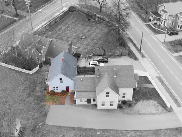 an aerial view of residential houses with outdoor space