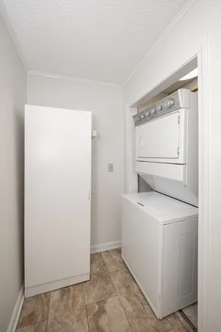 a view of a backyard with table and chairs and a fire pit