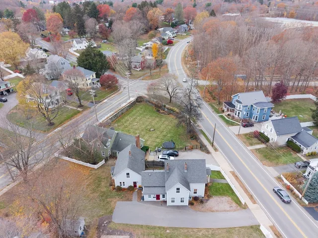 an aerial view of a house with a yard