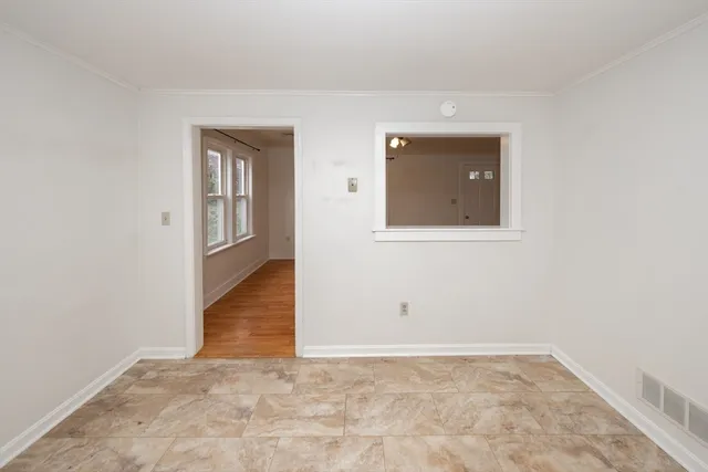 a view of a room with wooden floor and closet