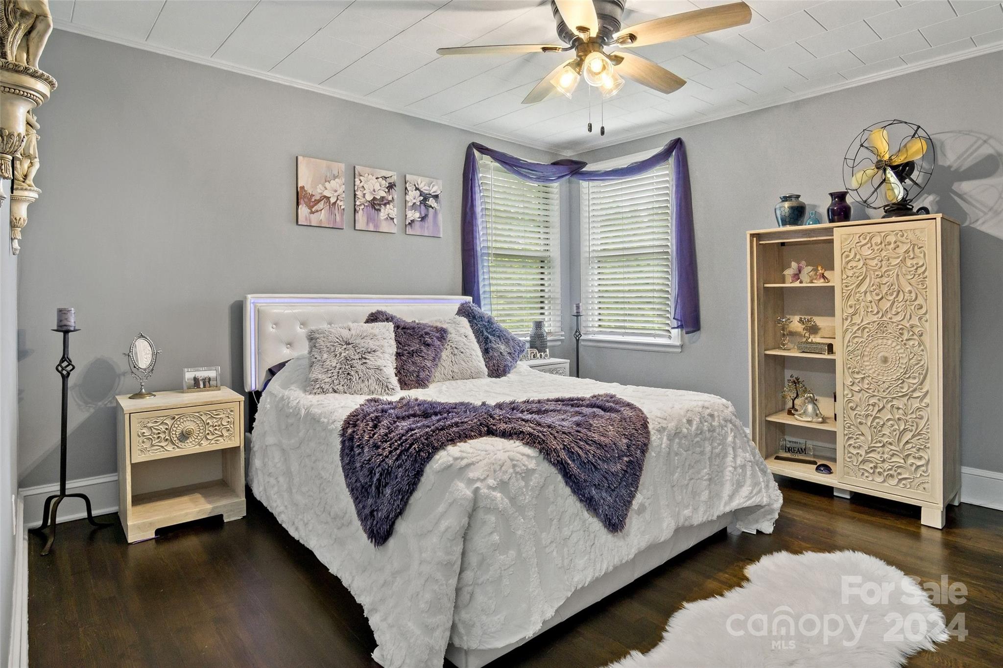 1798 Hopewell Road Morganton, NC 28655 - Photo 17 of 45 a bedroom with a bed and a chandelier
