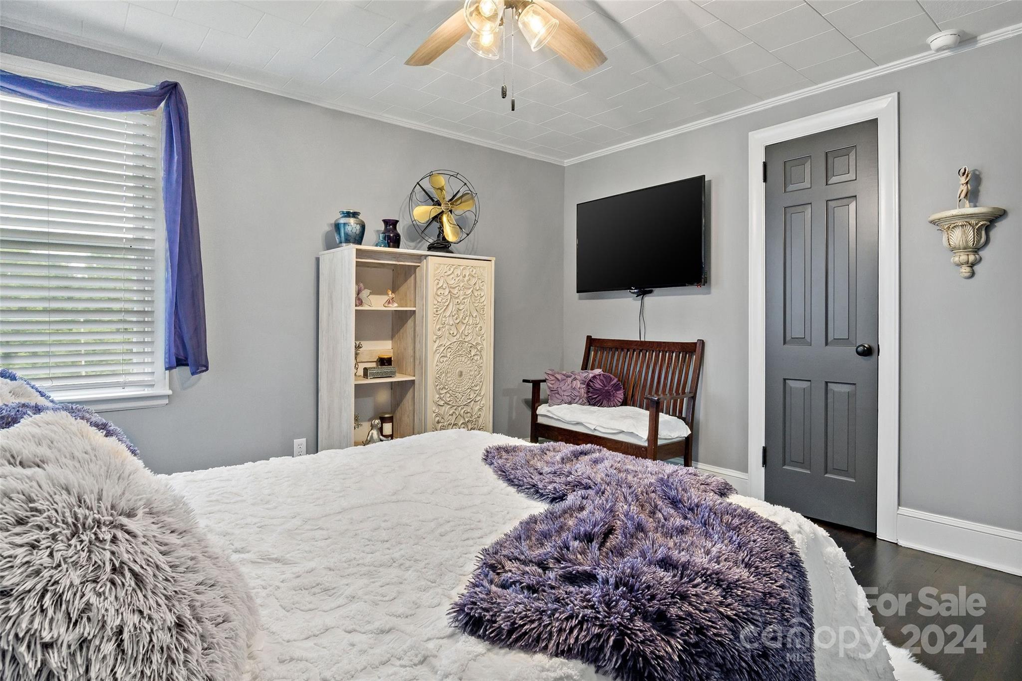 1798 Hopewell Road Morganton, NC 28655 - Photo 18 of 45 a bedroom with a bed and a flat screen tv
