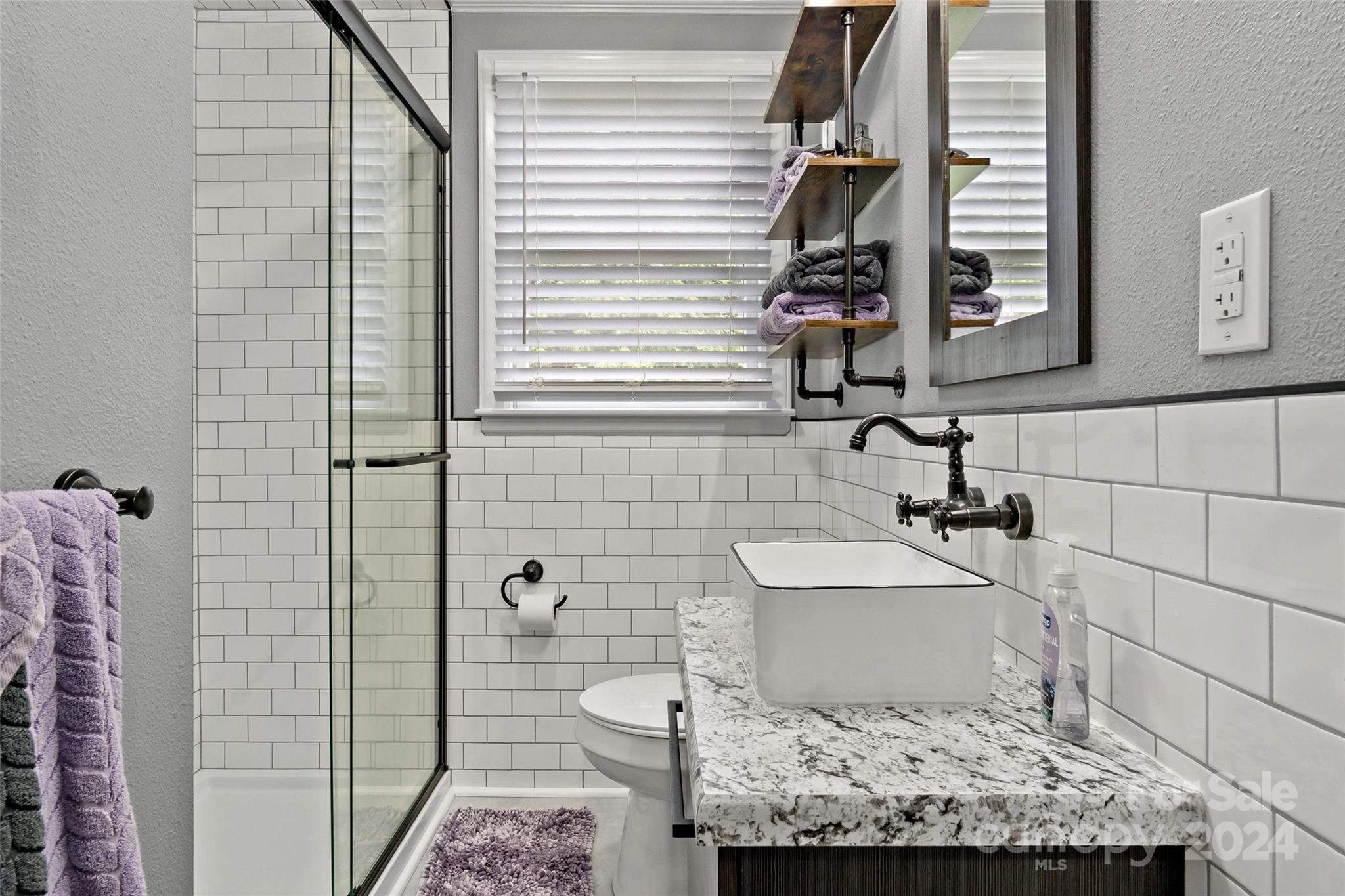 1798 Hopewell Road Morganton, NC 28655 - Photo 19 of 45 a bathroom with a sink and a mirror