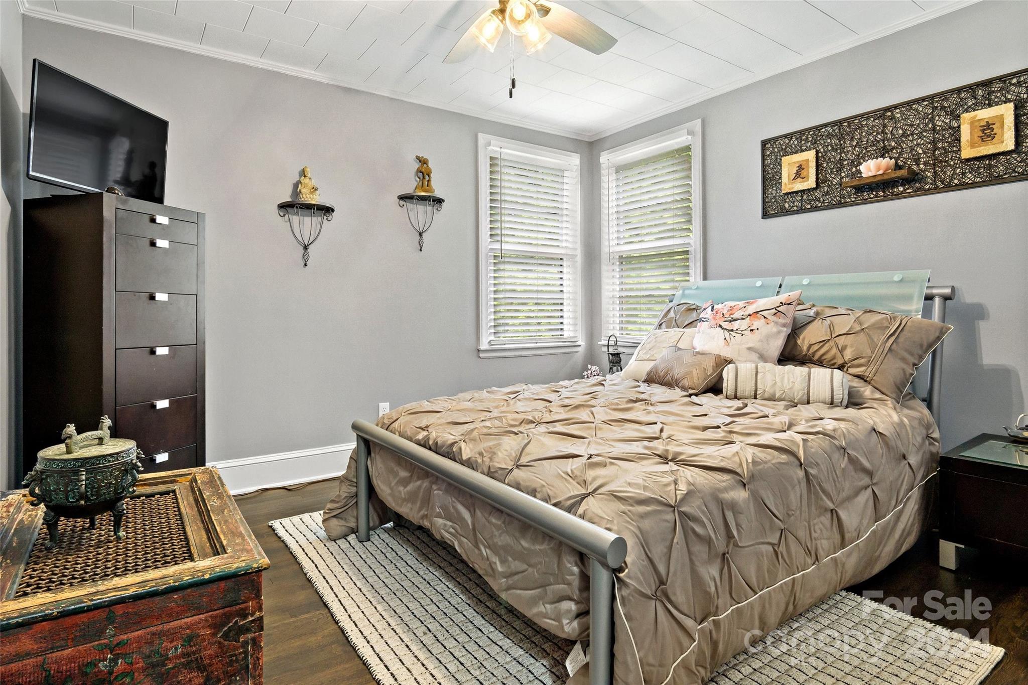 1798 Hopewell Road Morganton, NC 28655 - Photo 20 of 45 a bedroom with a bed and a chandelier
