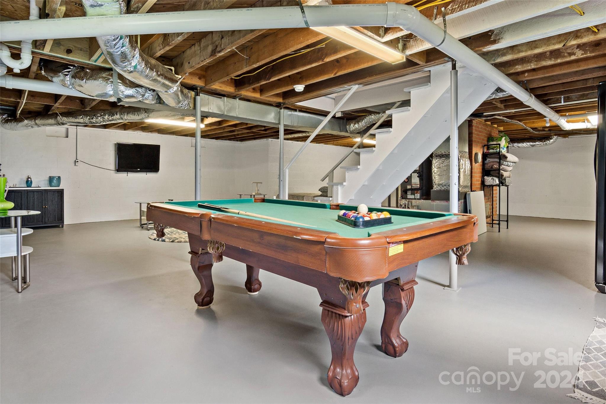1798 Hopewell Road Morganton, NC 28655 - Photo 26 of 45 a room with furniture and air hockey table